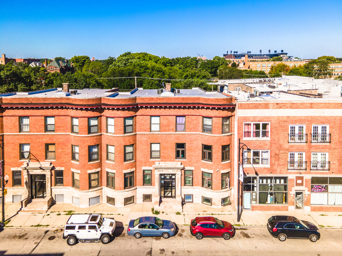 a view of a building with a yard