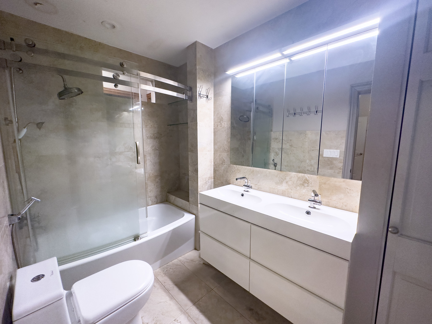 3714 South Indiana Avenue, Unit 2 Chicago, IL 60653 - Photo 12 of 18 a bathroom with a double vanity sink toilet mirror and bathtub