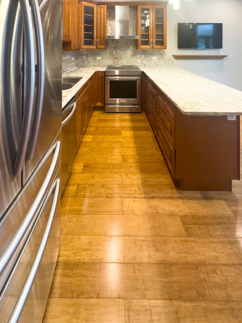 3714 South Indiana Avenue, Unit 2 Chicago, IL 60653 - Photo 7 of 18 a large kitchen with kitchen island a sink and a counter top space