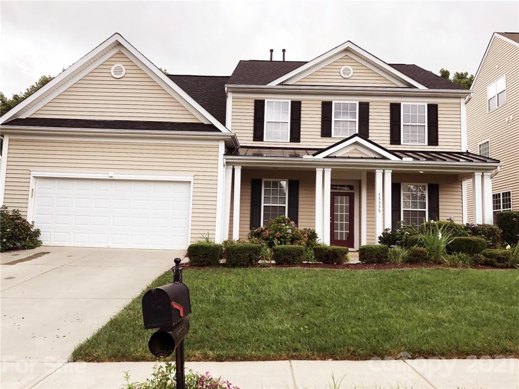 13338 Mallard Landing Road Charlotte, NC 28278 - Photo 1 of 2 a front view of a house with a yard