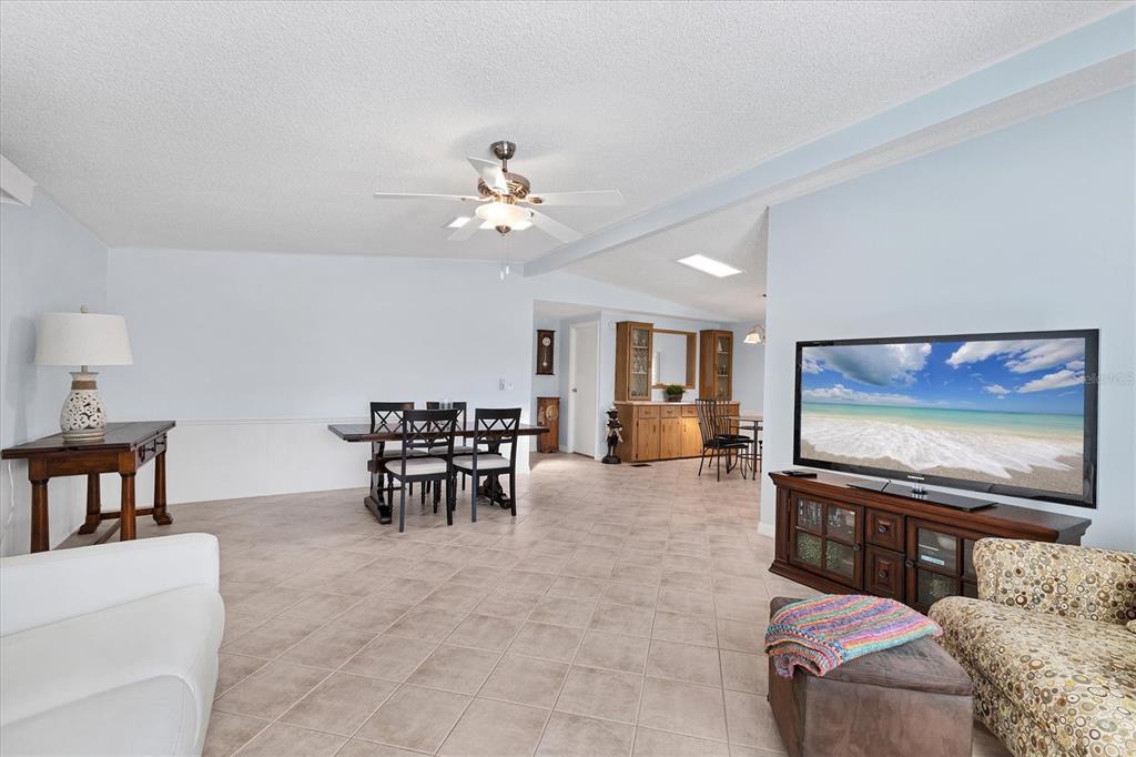 159 Osprey Circle Ellenton, FL 34222 - Photo 11 of 37 a living room with furniture and a flat screen tv