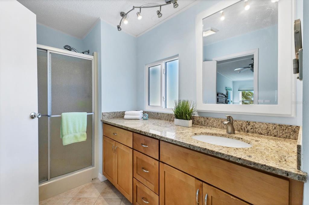 159 Osprey Circle Ellenton, FL 34222 - Photo 14 of 37 a bathroom with a granite countertop sink and a mirror