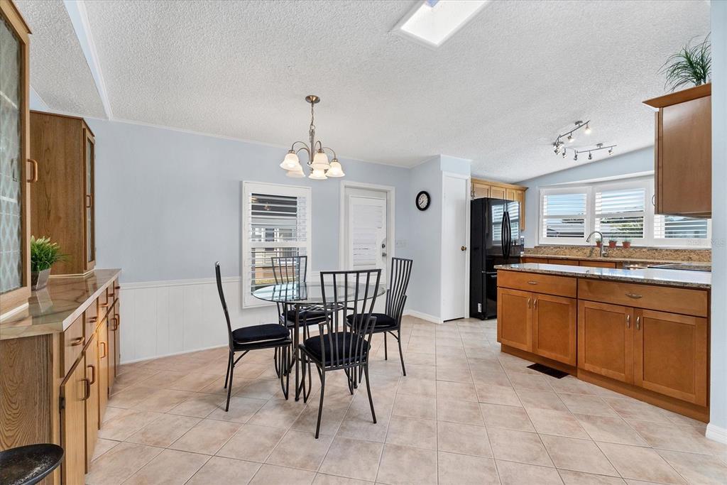 159 Osprey Circle Ellenton, FL 34222 - Photo 8 of 37 a view of a dining room with furniture and chandelier