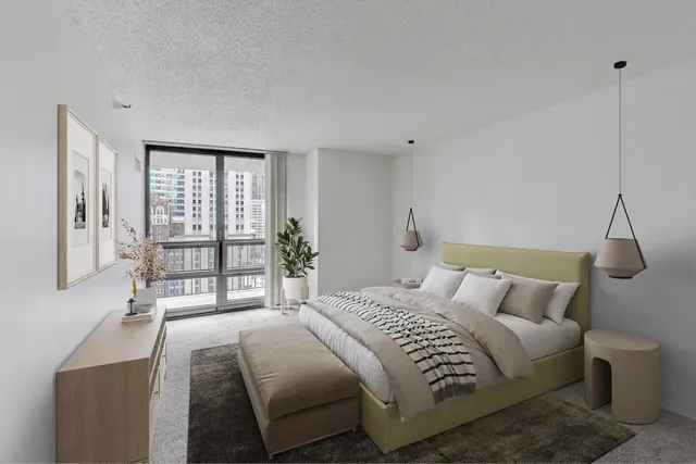 a bedroom with a large bed and a large window