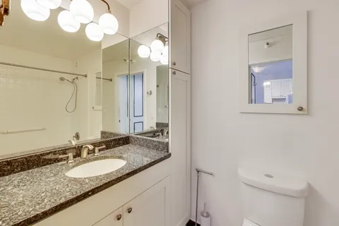 a bathroom with a bath tub with a shower