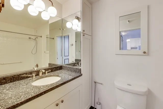 a bathroom with a bath tub with a shower