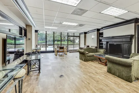 a work room with furniture and a rug