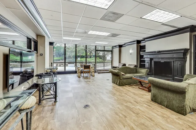 a work room with furniture and a rug