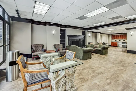 a room with furniture and a wooden floor