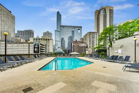 a view of a swimming pool with a patio