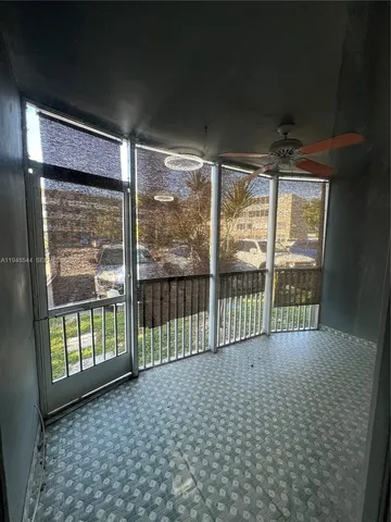 a view of a room with sliding glass door
