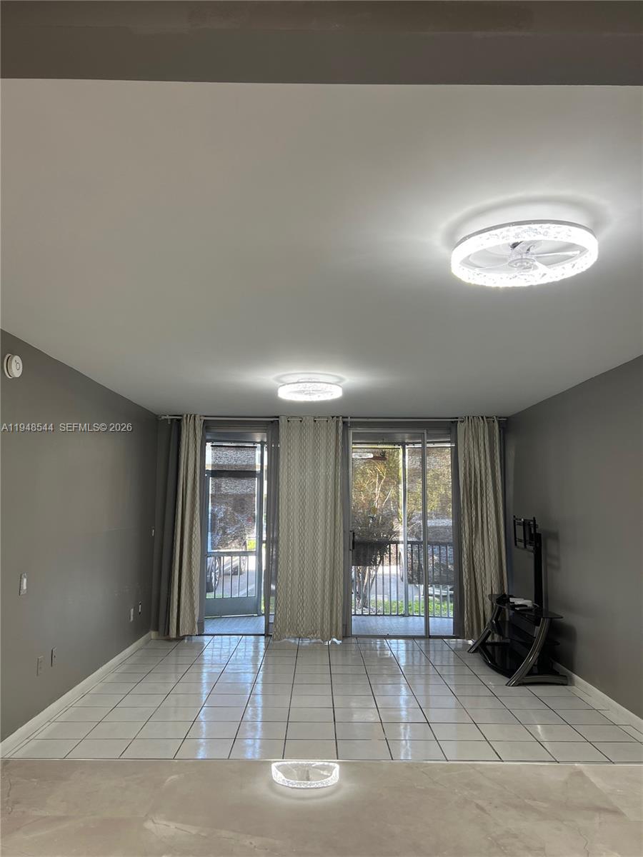 1710 Northeast 191st Street, Unit 1003 Miami, FL 33179 - Photo 7 of 16 a view of an empty room with a window