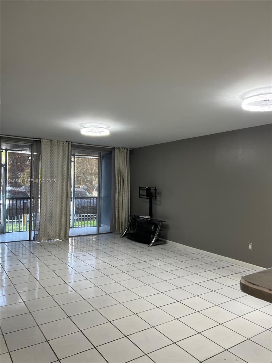 1710 Northeast 191st Street, Unit 1003 Miami, FL 33179 - Photo 8 of 16 a view of a livingroom with entryway