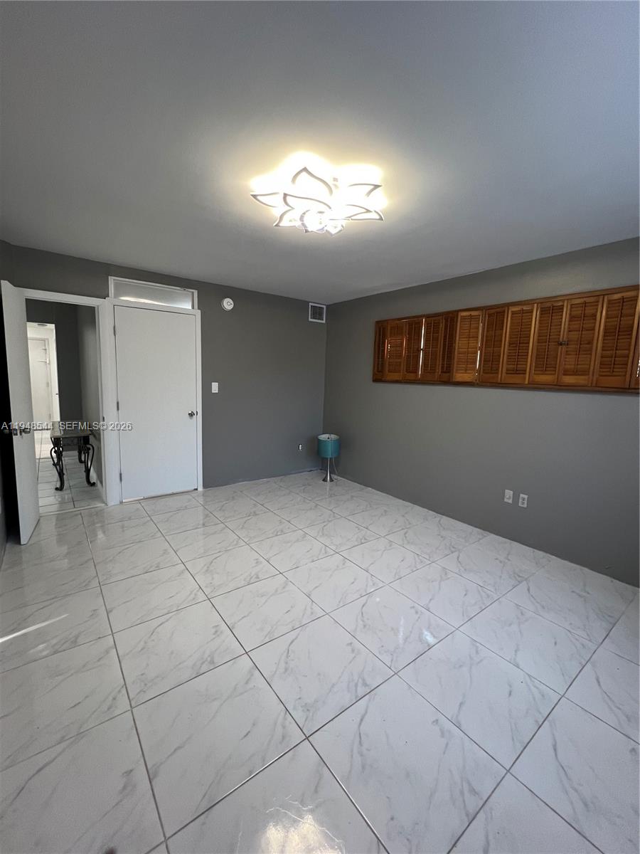 1710 Northeast 191st Street, Unit 1003 Miami, FL 33179 - Photo 9 of 16 a view of an empty room