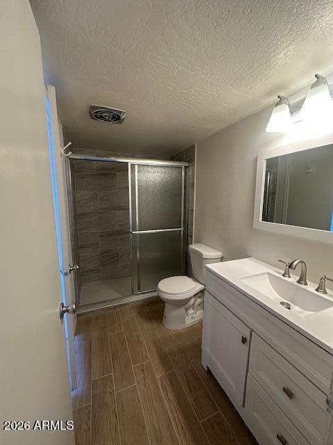 1101 East Bethany Home Road, Unit 16 Phoenix, AZ 85014 - Photo 12 of 15 a bathroom with a granite countertop sink toilet and shower