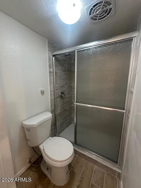1101 East Bethany Home Road, Unit 16 Phoenix, AZ 85014 - Photo 14 of 15 a bathroom with a toilet and a shower