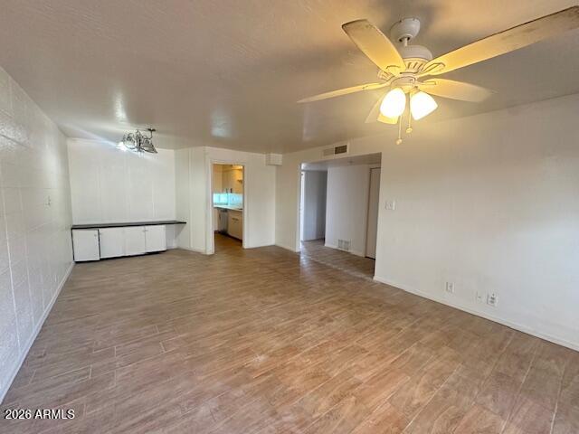 1101 East Bethany Home Road, Unit 16 Phoenix, AZ 85014 - Photo 2 of 15 wooden floor in an empty room