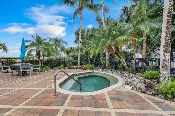 a view of a swimming pool with sitting area