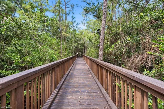 a view of house with outdoor space garden and swimming pool