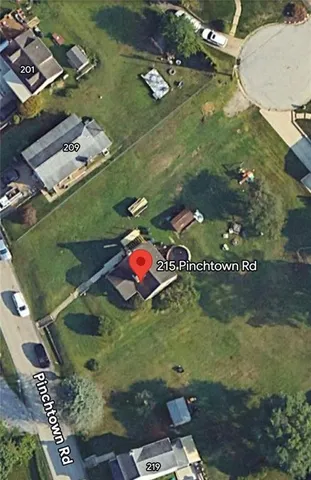 an aerial view of a residential houses with outdoor space