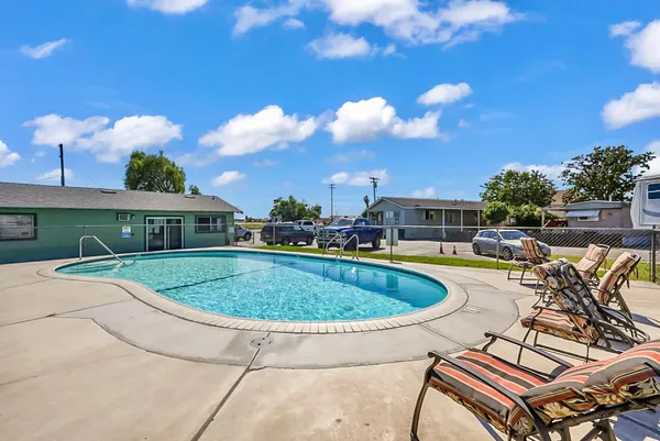a view of a swimming pool with a patio