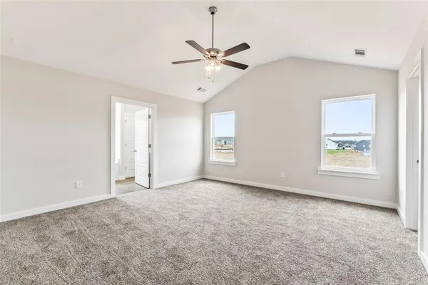 a view of an empty room with a window