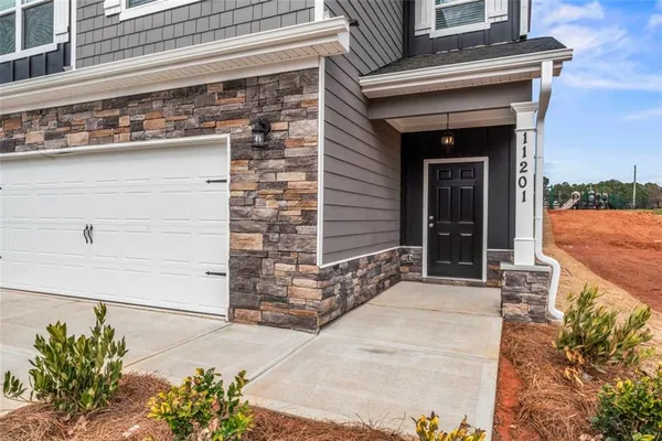 front view of a house with a yard