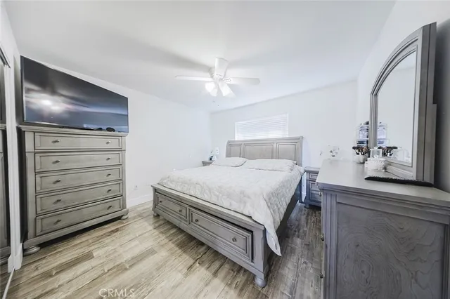 a bedroom with a bed and a dresser