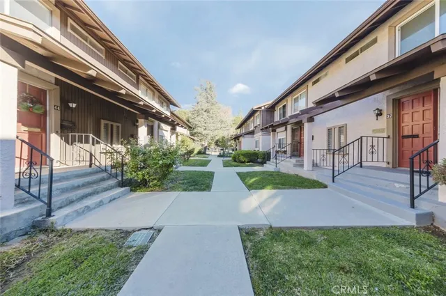 a view of a building with a yard