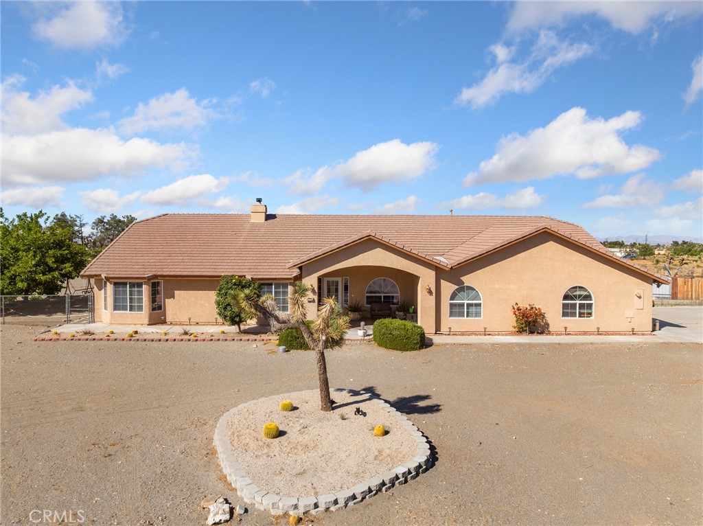 11025 El Esteban Road Phelan, CA 92371 - Photo 46 of 54 a front view of a house with a yard