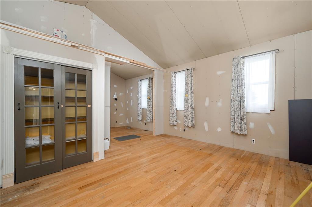438 Main Street Prospect, PA 16052 - Photo 29 of 46 a view of an empty room with wooden floor and a window