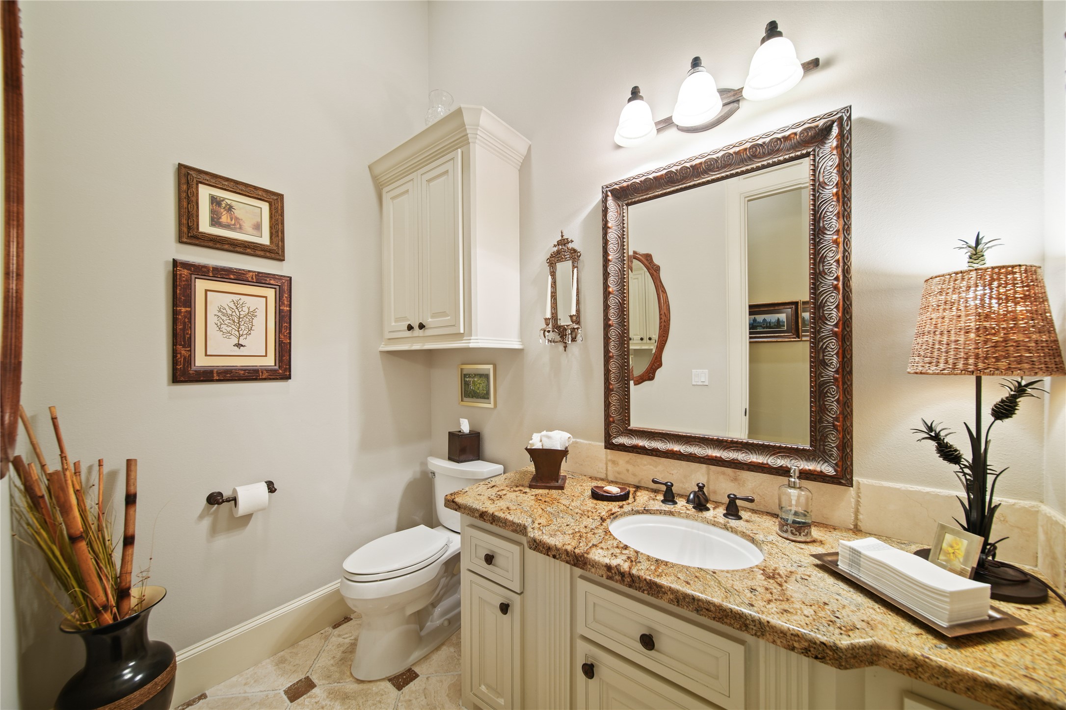 6702 Star Ledge Court Spring, TX 77389 - Photo 15 of 46 a bathroom with a granite countertop toilet sink and a mirror