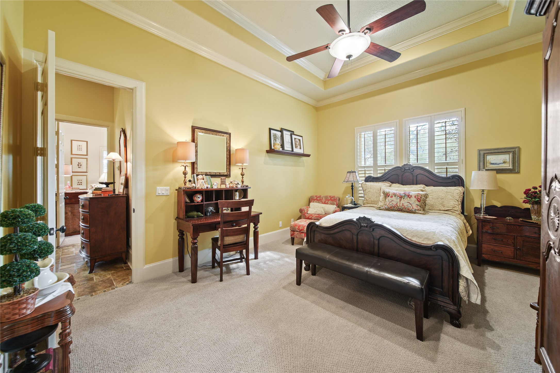 6702 Star Ledge Court Spring, TX 77389 - Photo 18 of 46 a bedroom with a bed and a chandelier