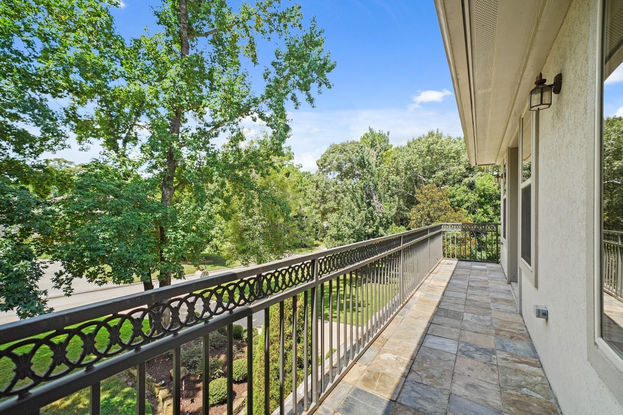 6702 Star Ledge Court Spring, TX 77389 - Photo 30 of 46 a view of a balcony with wooden floor and fence