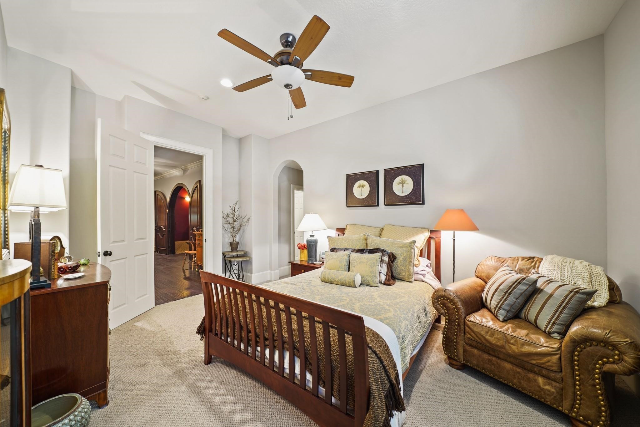 6702 Star Ledge Court Spring, TX 77389 - Photo 33 of 46 a bedroom with a bed couch and a window