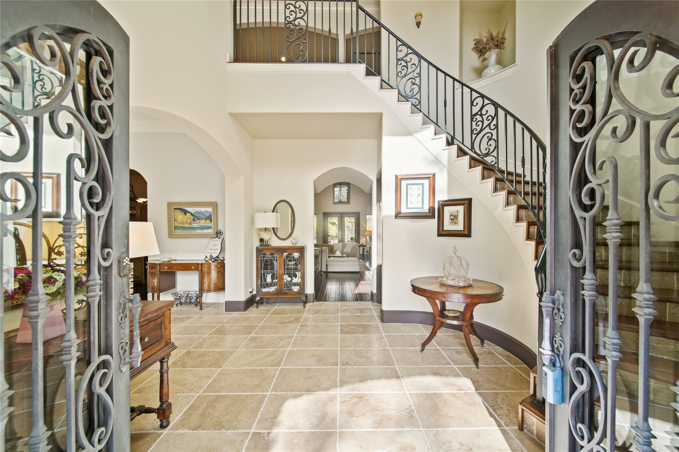 6702 Star Ledge Court Spring, TX 77389 - Photo 7 of 46 Double Front Wood Doors with Scrolled Cantera Wrought Iron with Opening Glass ~ Custom Wrought Iron Spiral Staircase with Scroll Details