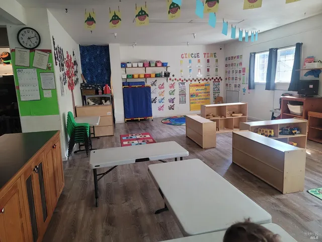 a bedroom with a bed and a book shelf