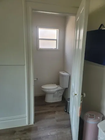 a view of a bathroom with a toilet