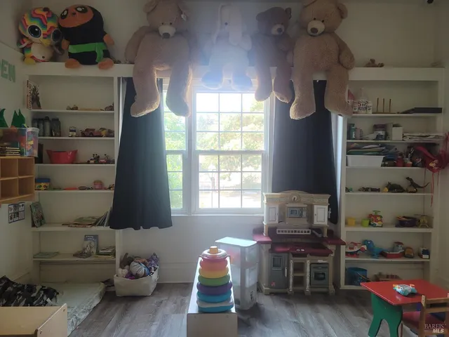 a toilet sitting in a bathroom next to a sink