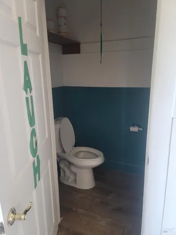 view of a room with wooden floor and windows