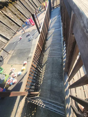 a view of deck with wooden floor and fence