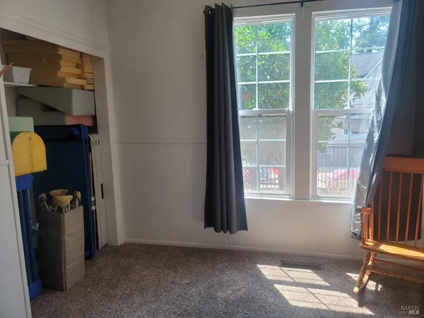 a view of water porch with wooden fence and a porch