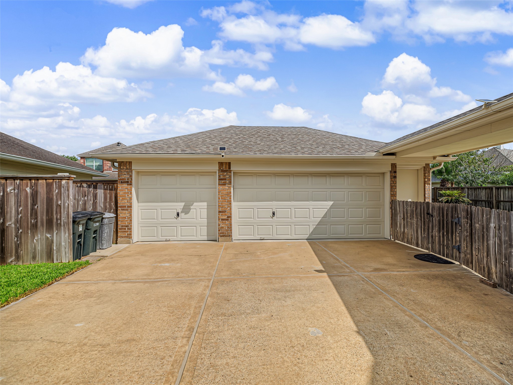 2210 Fox Path Katy, TX 77494 - Photo 47 of 47 This front-facing perspective highlights the incredible vehicular storage and parking capabilities of the property, showcasing a massive detached garage setup that is a rare and highly desirable find.