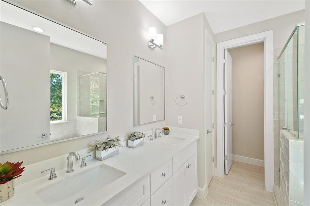 2504 West Tidwell Road, Unit G Houston, TX 77091 - Photo 23 of 30 a bathroom with a double vanity sink mirror and next