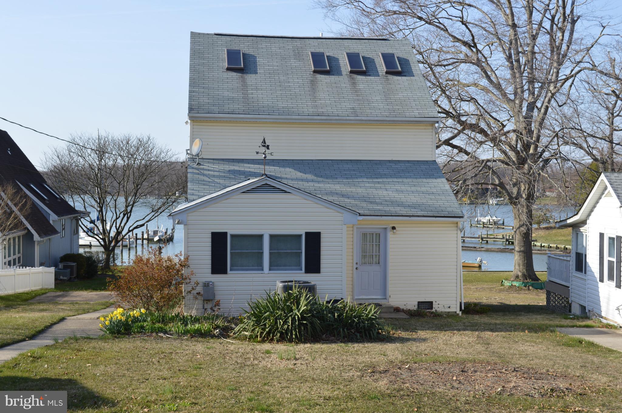 2124 Poplar Road Baltimore, MD 21221 - Photo 2 of 29 a front view of a house with a yard