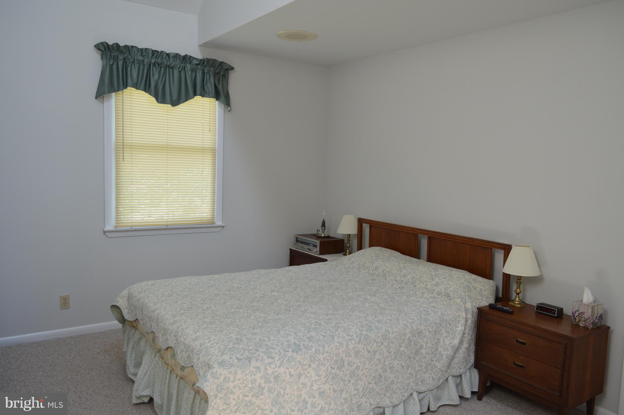 2124 Poplar Road Baltimore, MD 21221 - Photo 13 of 29 a bedroom with a bed and window