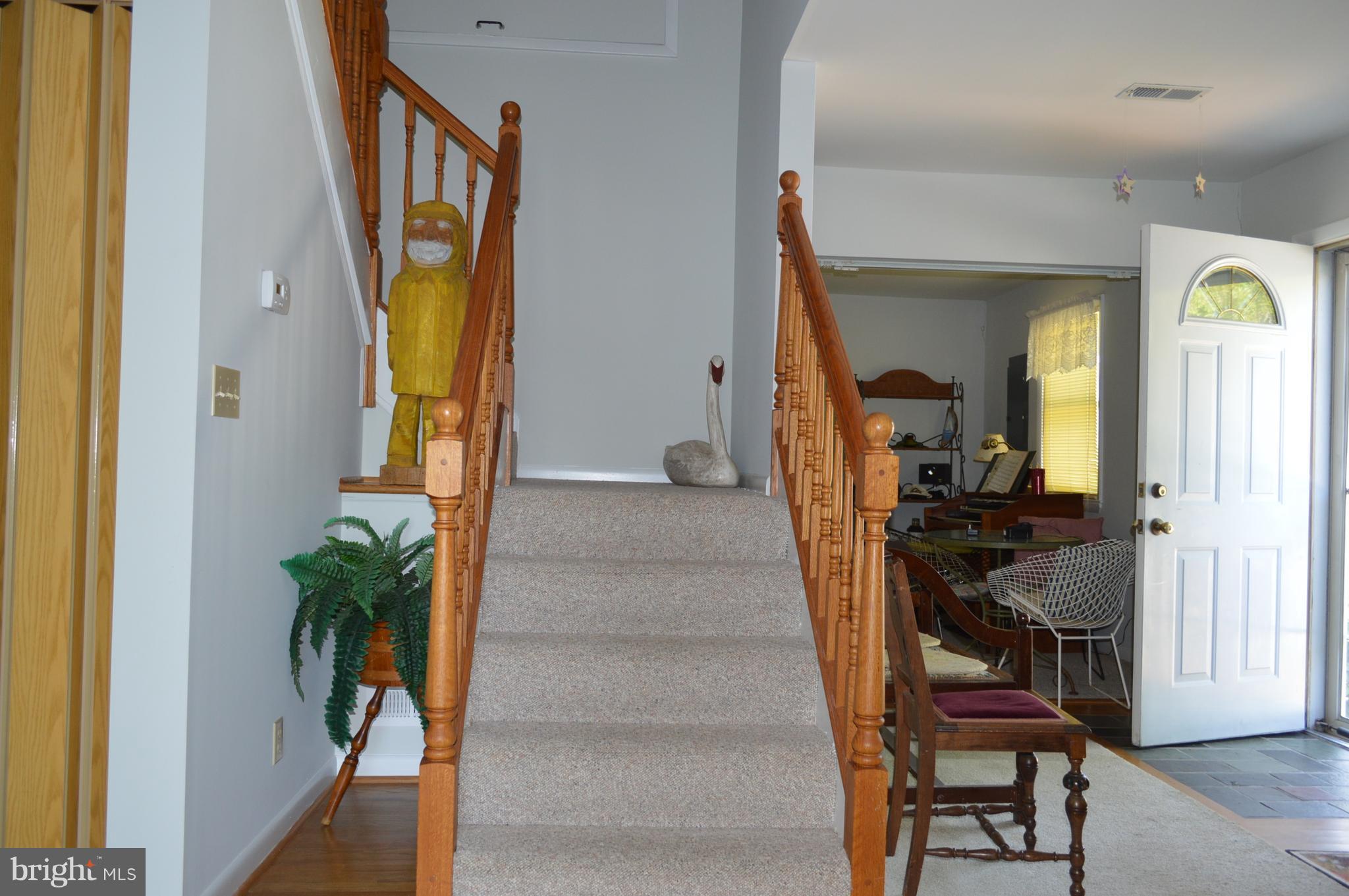 2124 Poplar Road Baltimore, MD 21221 - Photo 18 of 29 a view of an entryway with wooden floor and a livingroom view