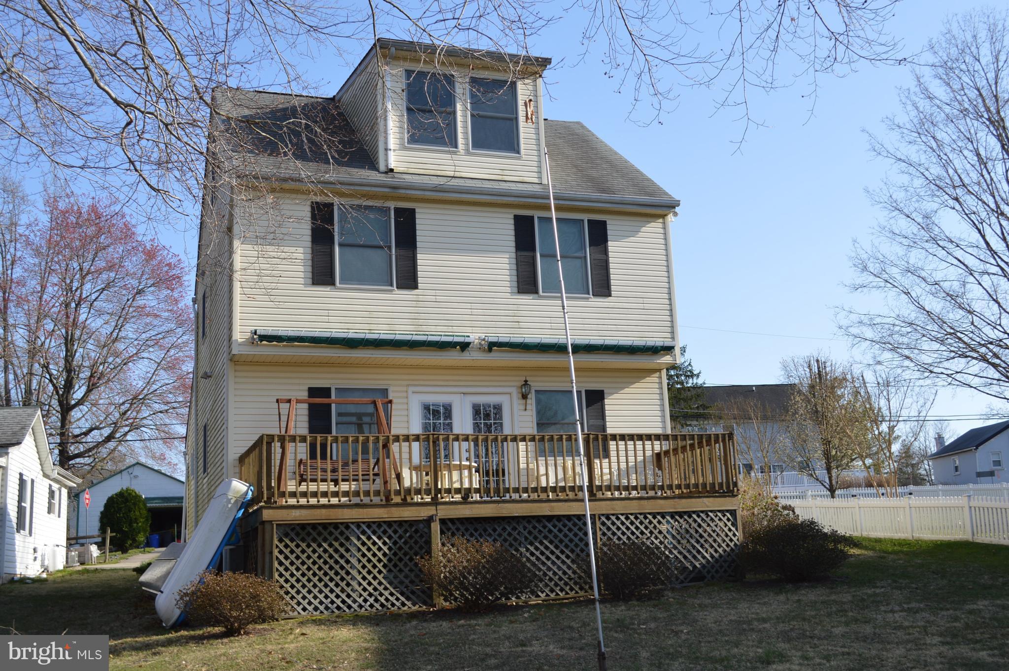 2124 Poplar Road Baltimore, MD 21221 - Photo 6 of 29 a front view of a house with a yard