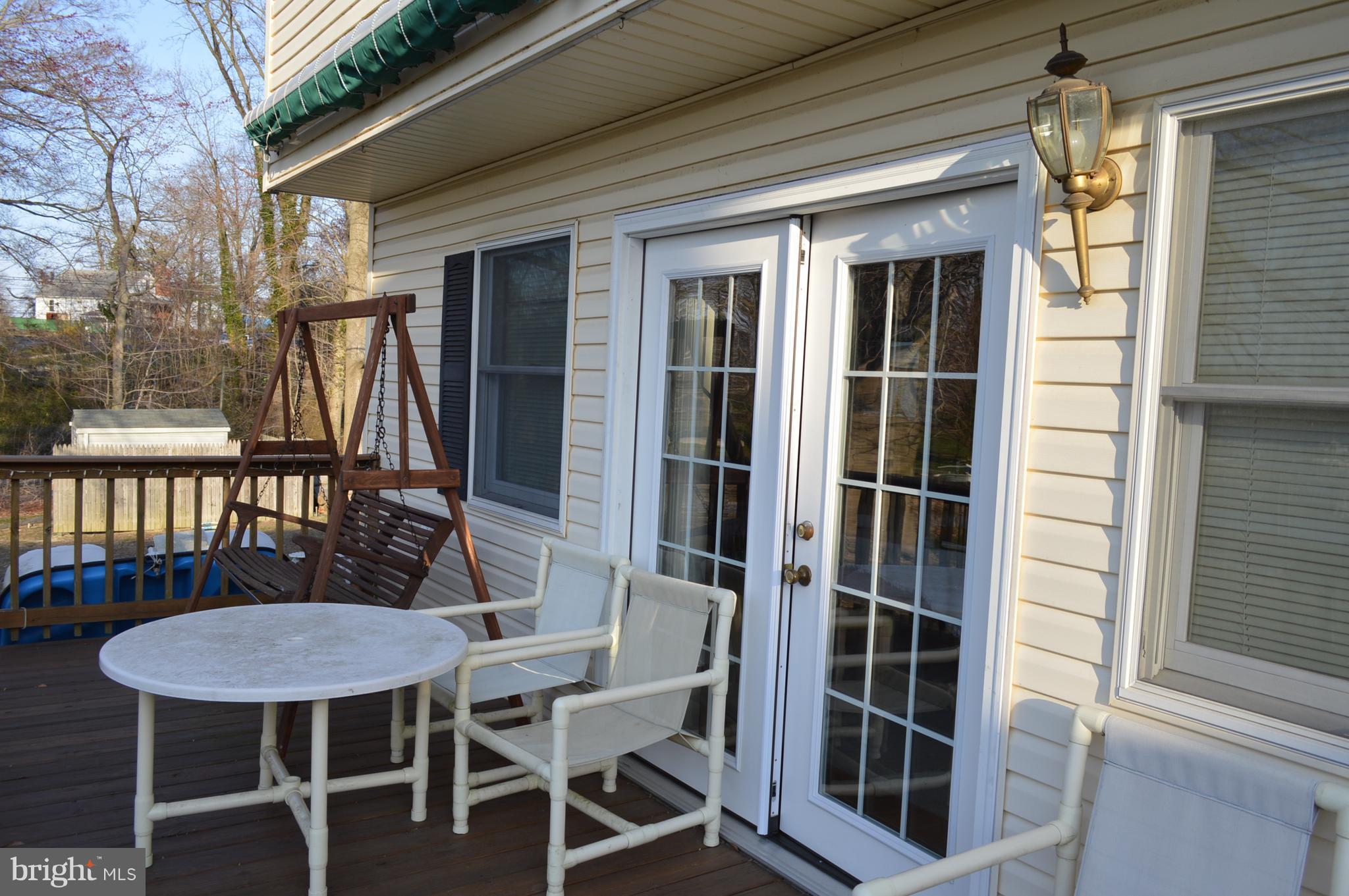 2124 Poplar Road Baltimore, MD 21221 - Photo 9 of 29 a view of a balcony with table and chairs