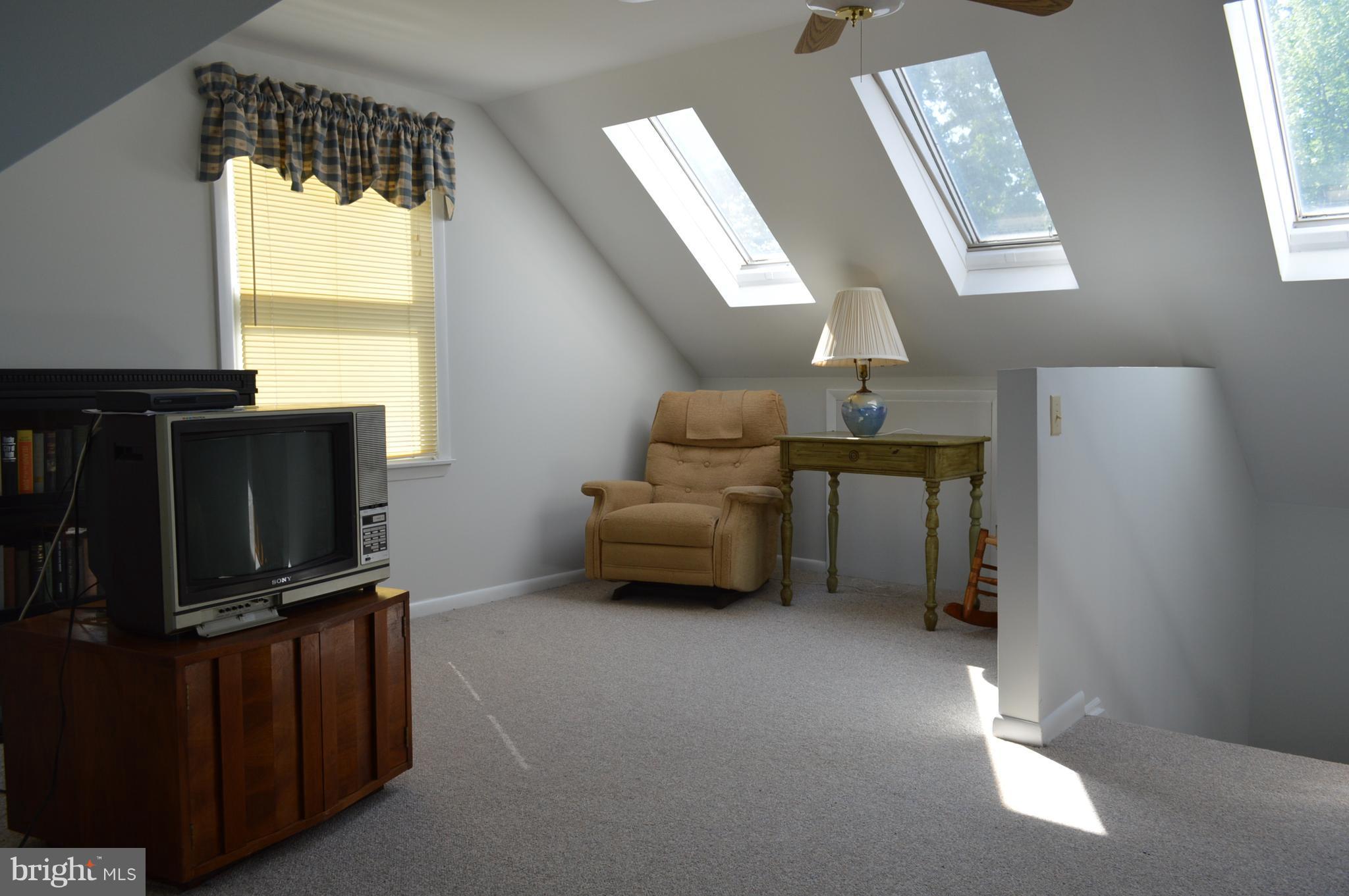2124 Poplar Road Baltimore, MD 21221 - Photo 10 of 29 a living room with furniture a flat screen tv and a window